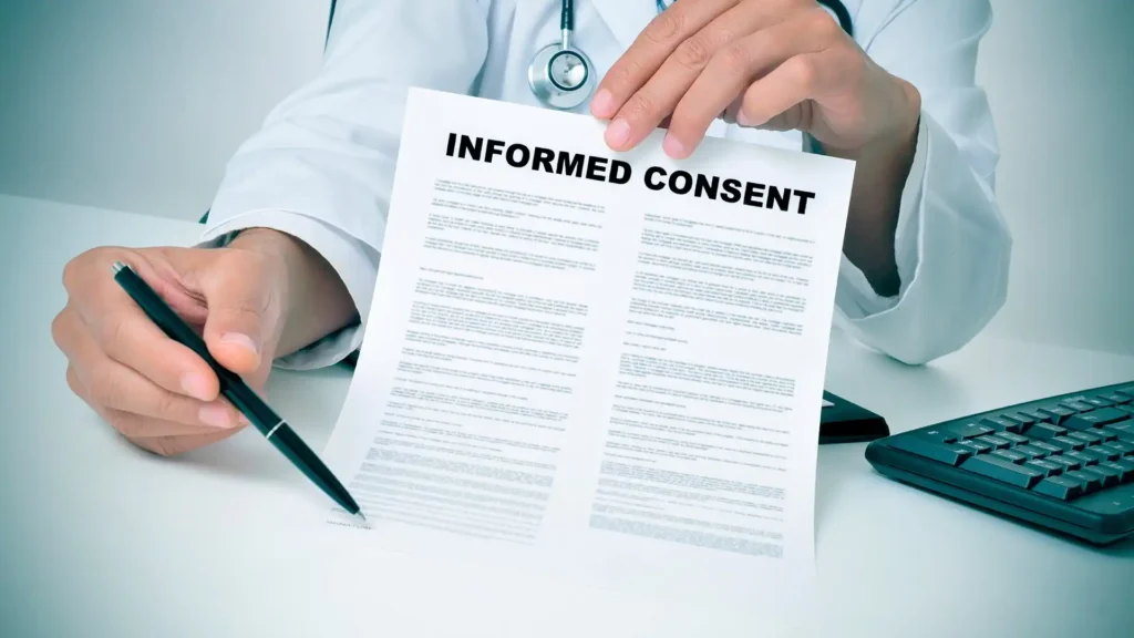 Cosmetic surgery risks abroad — patient reviewing clinic documents and surgical consent forms for cosmetic surgery tourism