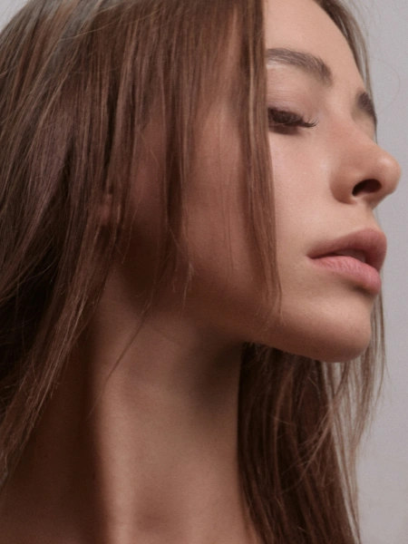 woman with side-profile view after rhinoplasty – cosmetic nose surgery for rhinoplasty surgery compensation claim