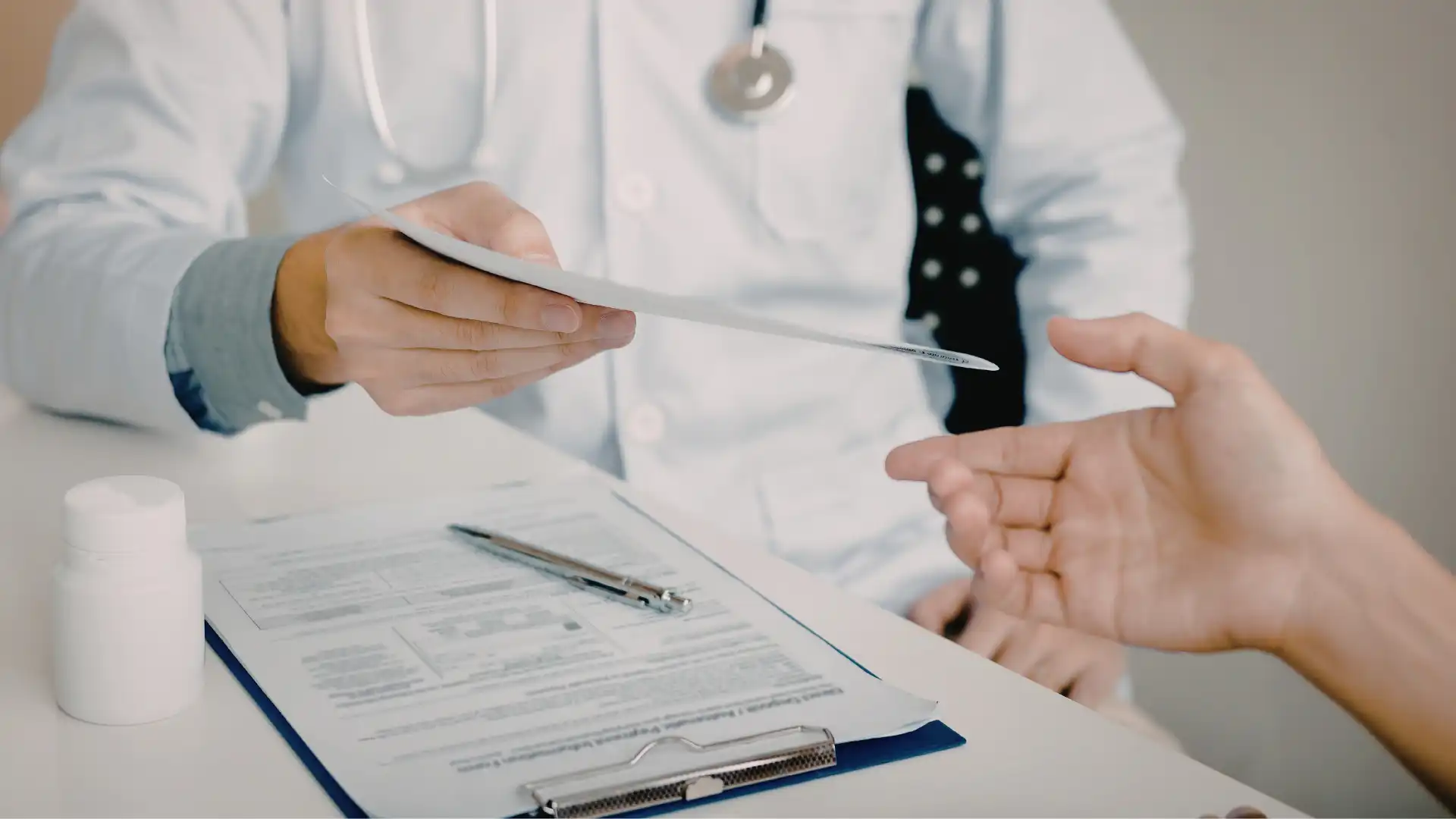 Cosmetic surgery claim evidence — patient organising medical records, photos and correspondence for negligence claim